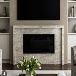 sleek fireplace surround by Taj Mahal quartzite