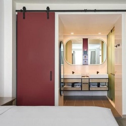 sliding wooden barn door hotel bathroom