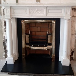 white staturay marble fireplace mantel with doric column
